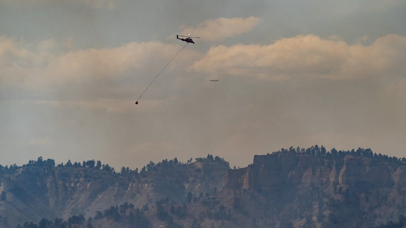 Crews battle the South Fork Fire as it burns at Fort Robinson State Park in the Nebraska...