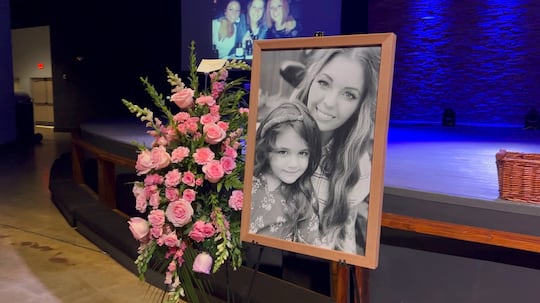A picture of Tesla and her daughter Harbor at Tesla's funeral.