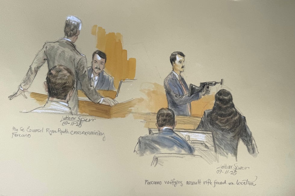 This courtroom sketch shows Secret Service agent Robert Fercano holding up the weapon found in...
