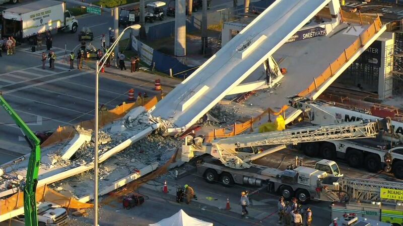 Drone captures scene where a pedestrian bridge collapsed at Florida International University...
