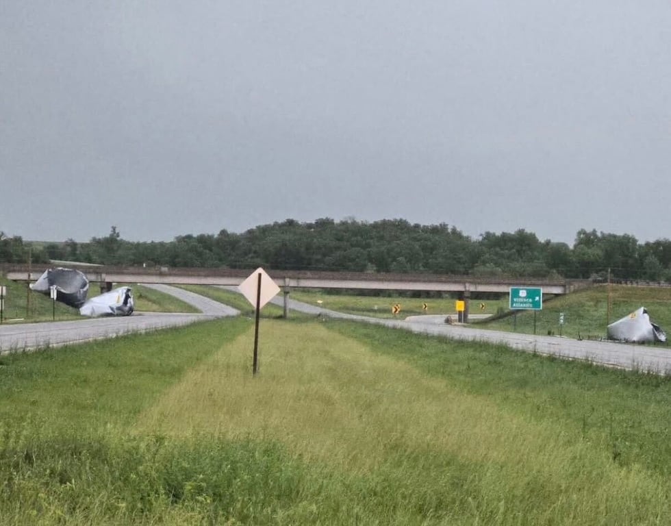 The Iowa Department of Transportation shared a photo of damaged grain bins blown near the...
