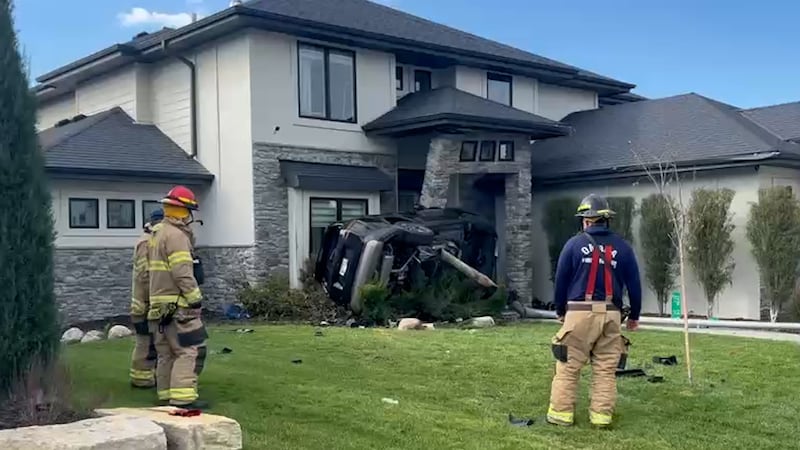 A vehicle hit the front of a West Omaha house near 180th Street and West Maple Road on...