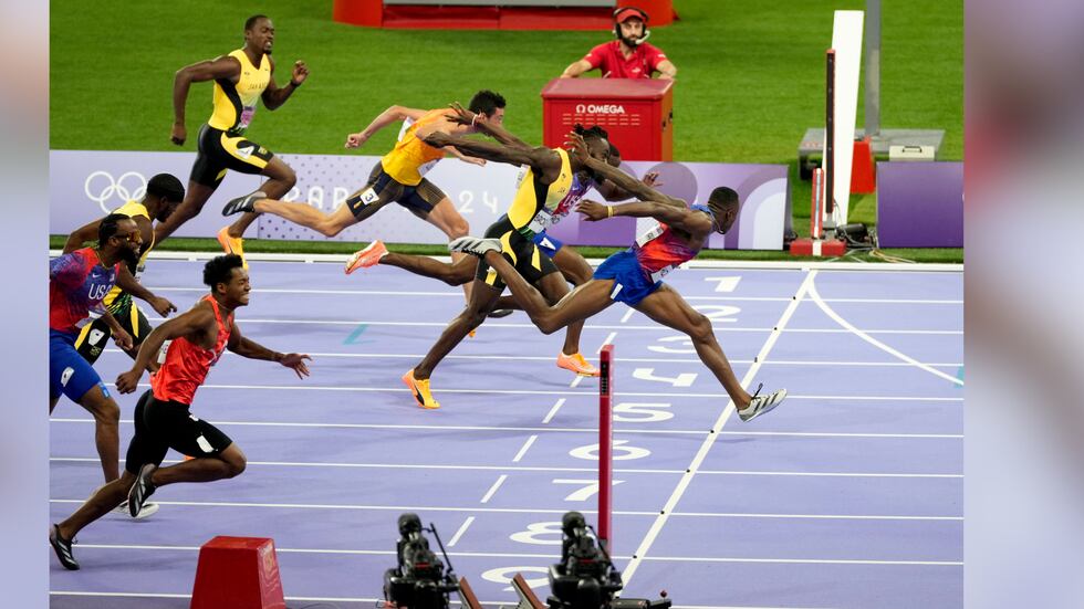 Grant Holloway, of the United States, crosses the finish line in the men's 110-meters hurdles...