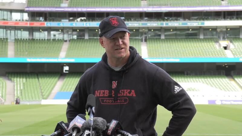 Scott Frost talks to the media following practice in Ireland on Thursday.