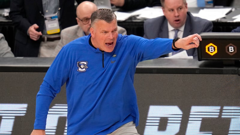 Creighton head coach Greg McDermott gives instructions during the second half of a college...