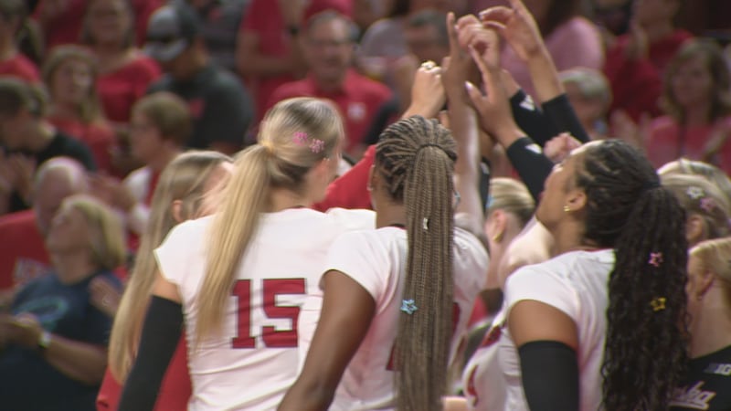 Nebraska volleyball players huddle during the Red vs. White Scrimmage.