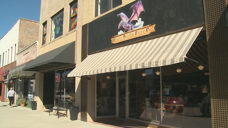 Two adjoining downtown businesses — the Purple Dragon Paper Company and the Wise Olde Owl gift...