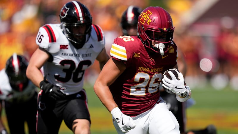 Iowa State running back Carson Hansen (26) runs from Arkansas State linebacker Charles...