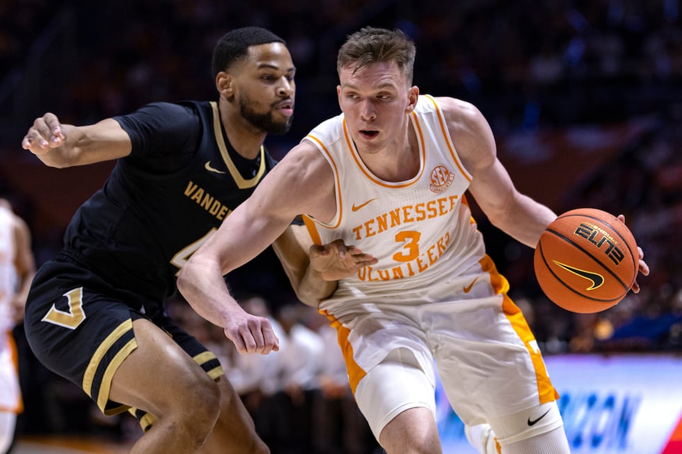 Tennessee guard Dalton Knecht (3) drives as Vanderbilt guard Isaiah West (4) defend during the...