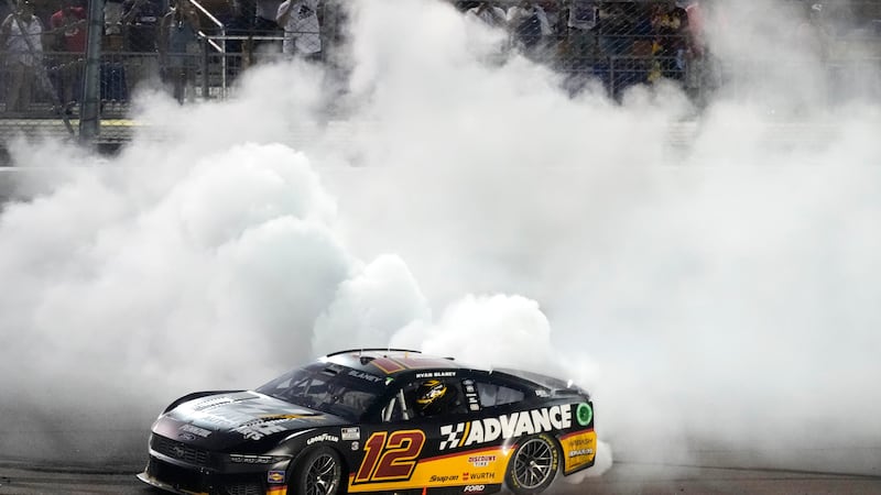 Ryan Blaney does a burnout after winning a NASCAR Cup Series auto race, Sunday, June 16, 2024,...