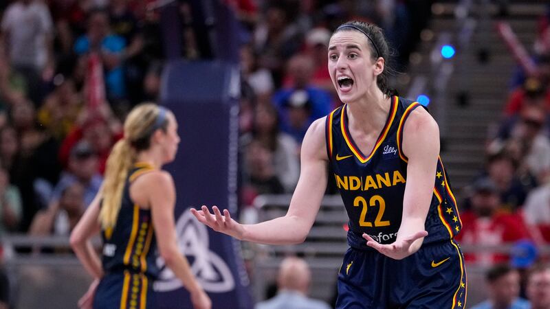 Indiana Fever guard Caitlin Clark (22) questions the lack of a foul in the second half of a...
