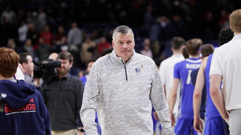 Creighton head coach Greg McDermott walks on the court after an NCAA college basketball game...