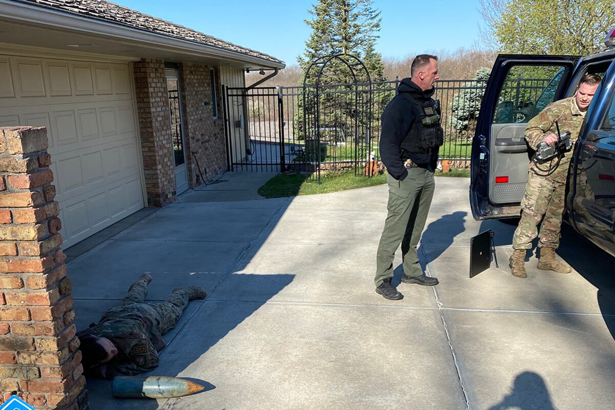 Landscape work unearths buried military shell at Omaha residence