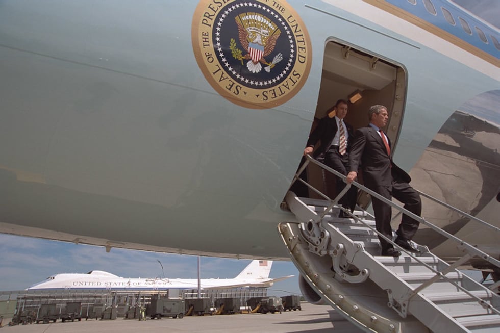 In this file photo from the U.S. National Archives, President Bush deplanes Air Force One at...