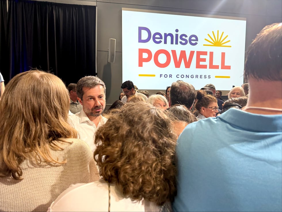 Former U.S. Transportation Secretary Pete Buttigieg talks with supporters on Tuesday, July 14,...