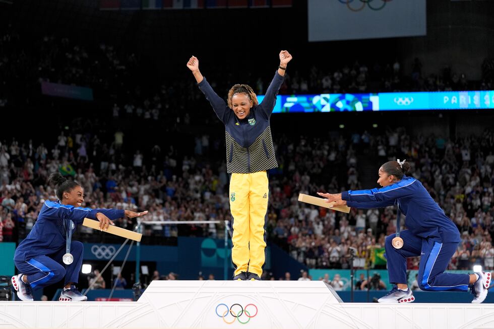 Silver medalist Simone Biles, of the United States, left, and bronze medalist Jordan Chiles,...