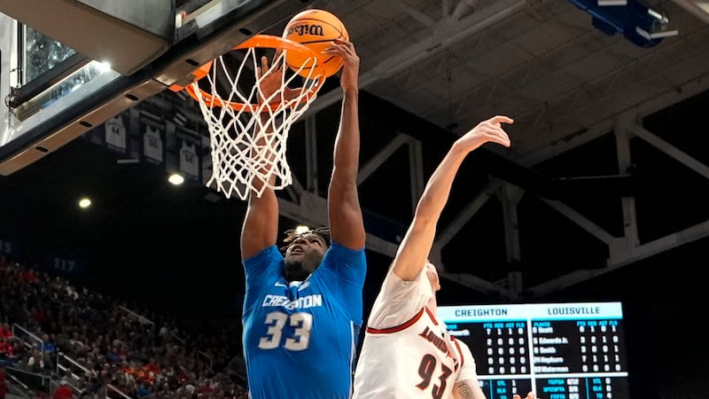 Creighton center Fredrick King (33) dunks against Louisville forward Noah Waterman (93) during...