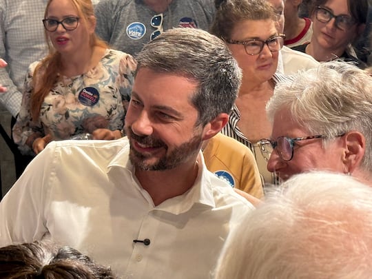 Former U.S. Transportation Secretary Pete Buttigieg talks with supporters on Tuesday, July 14,...